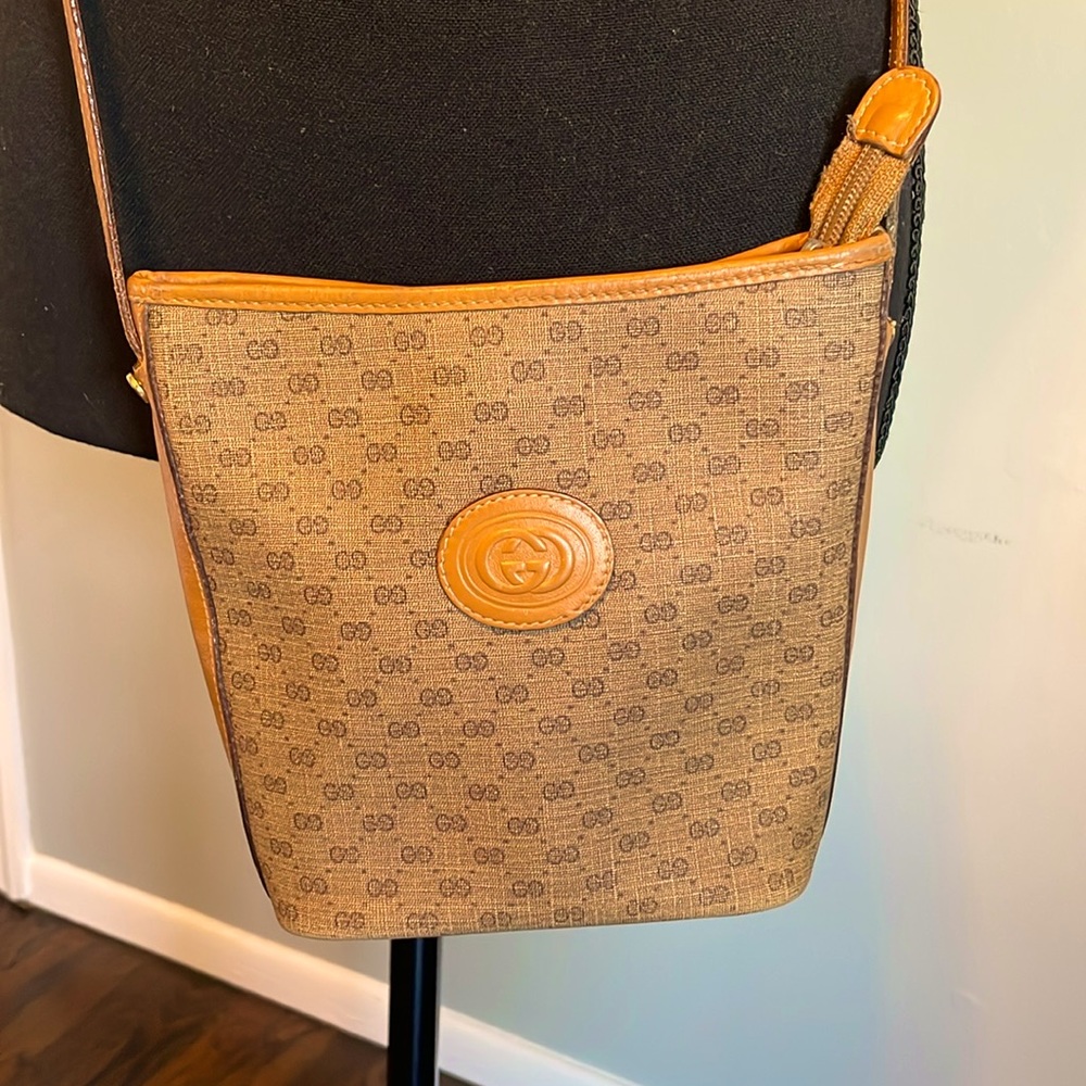 Authentic Gucci brown coated monogram canvas with leather trim crossbody bag